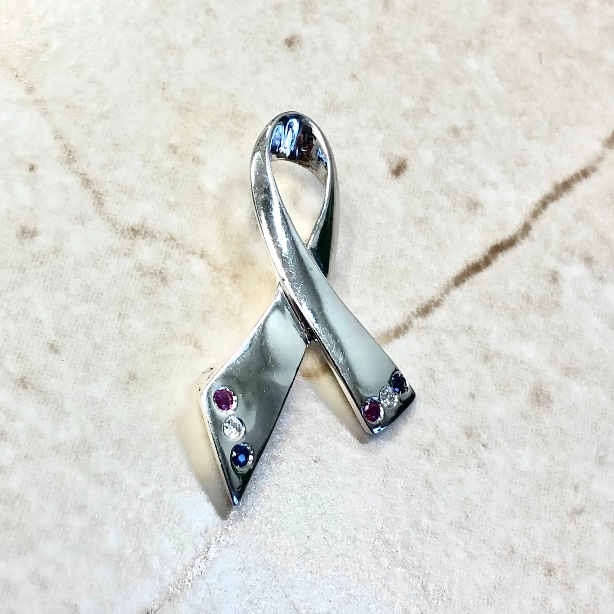 14 Karat White Gold Ruby, Sapphire & Diamond Ribbon Brooch