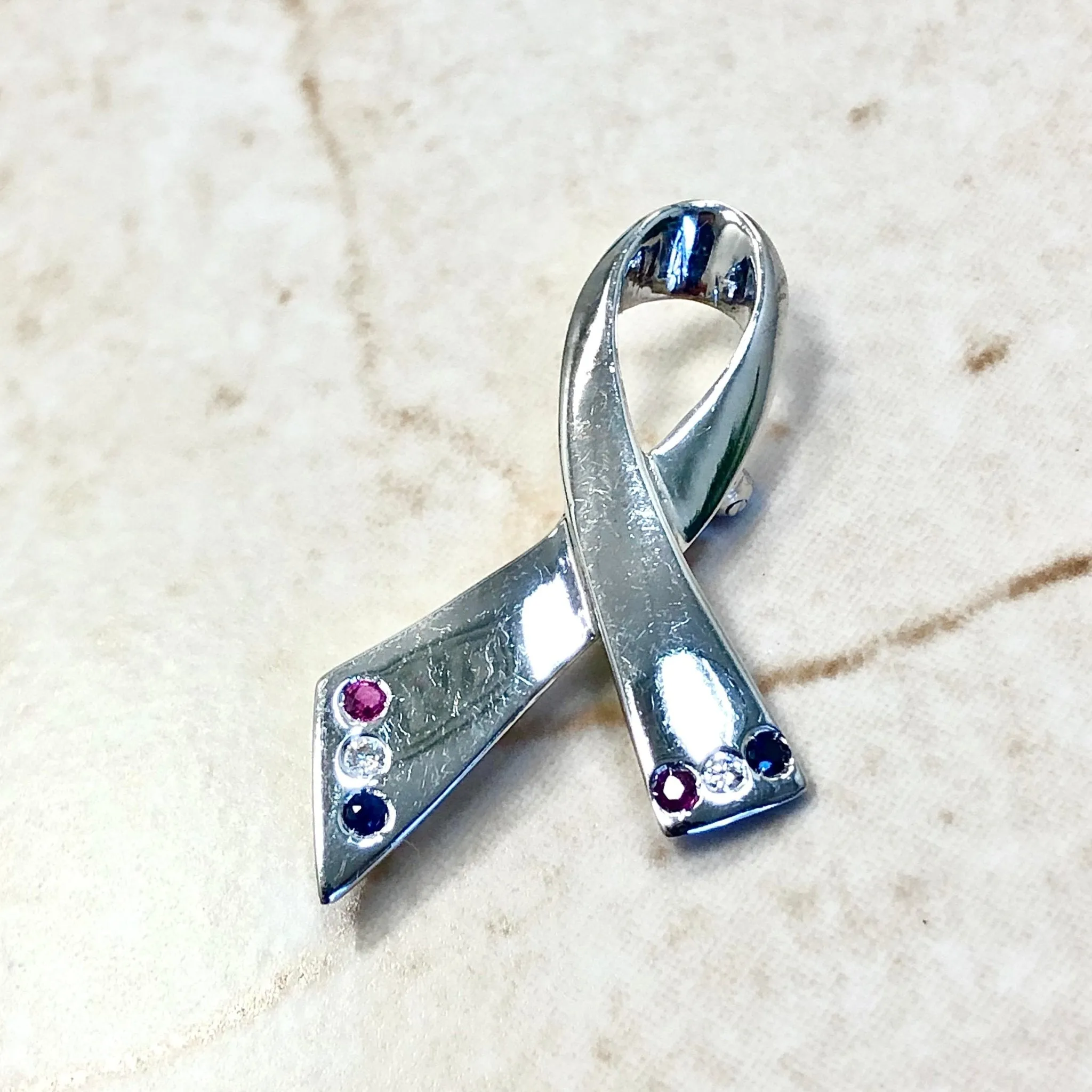 14 Karat White Gold Ruby, Sapphire & Diamond Ribbon Brooch