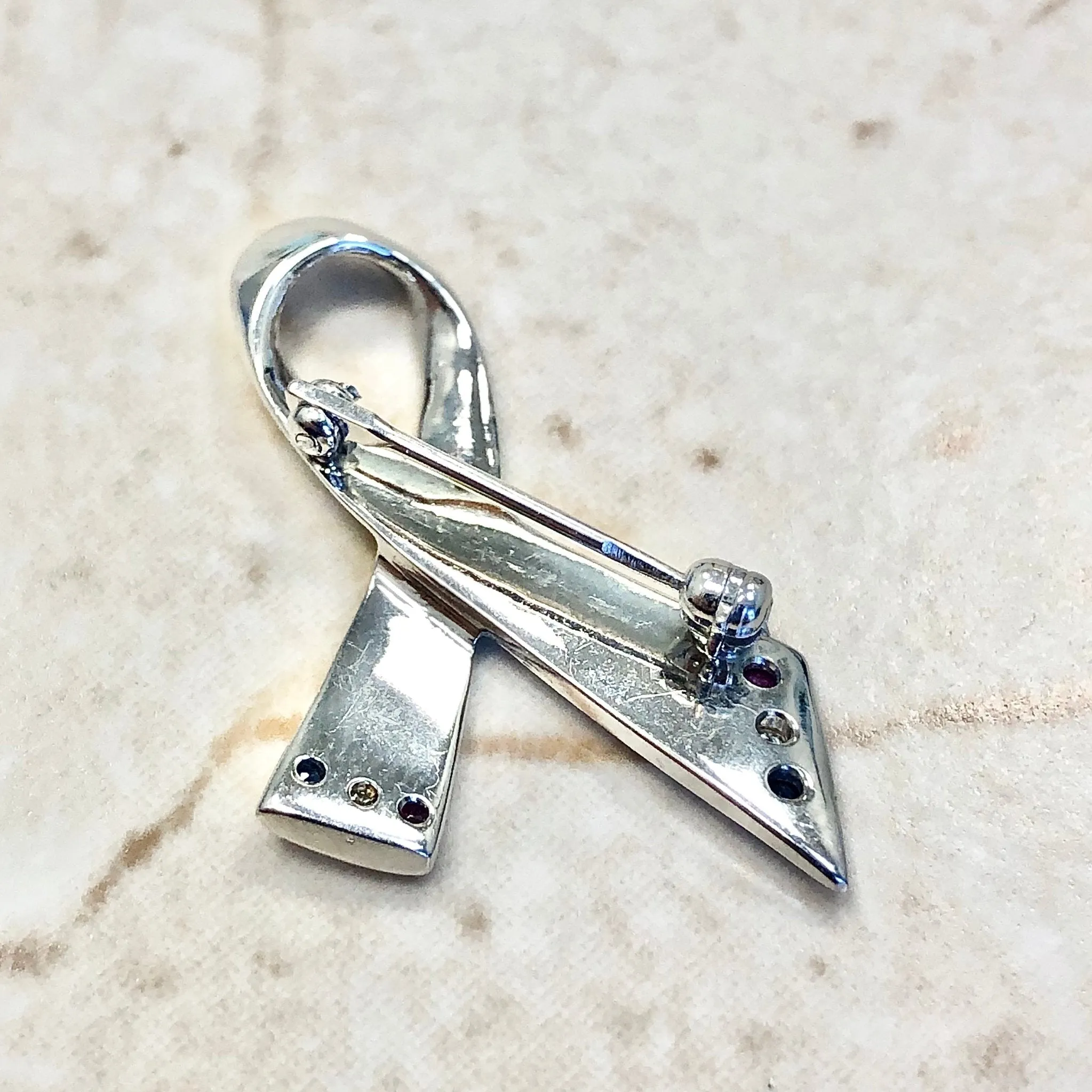 14 Karat White Gold Ruby, Sapphire & Diamond Ribbon Brooch
