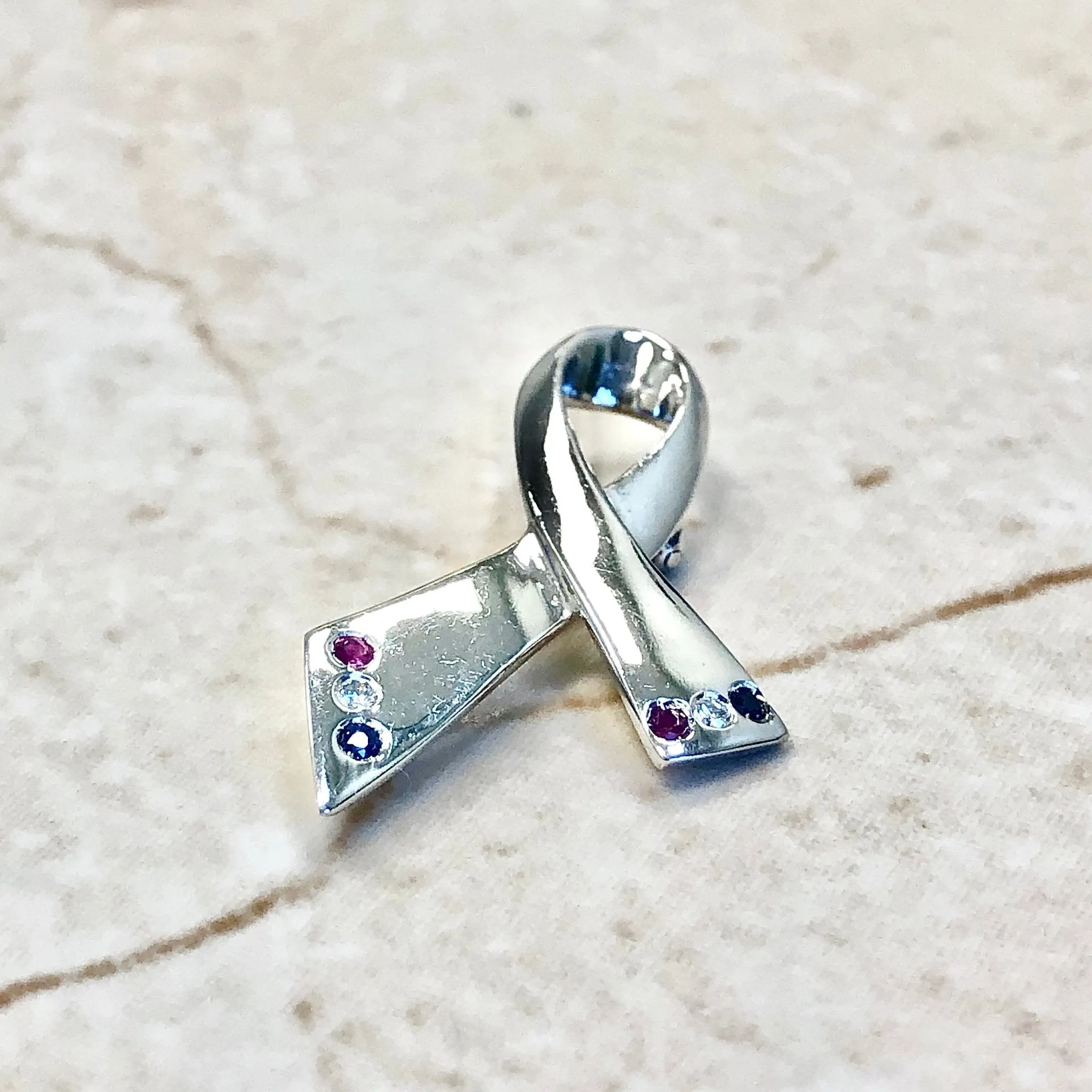 14 Karat White Gold Ruby, Sapphire & Diamond Ribbon Brooch