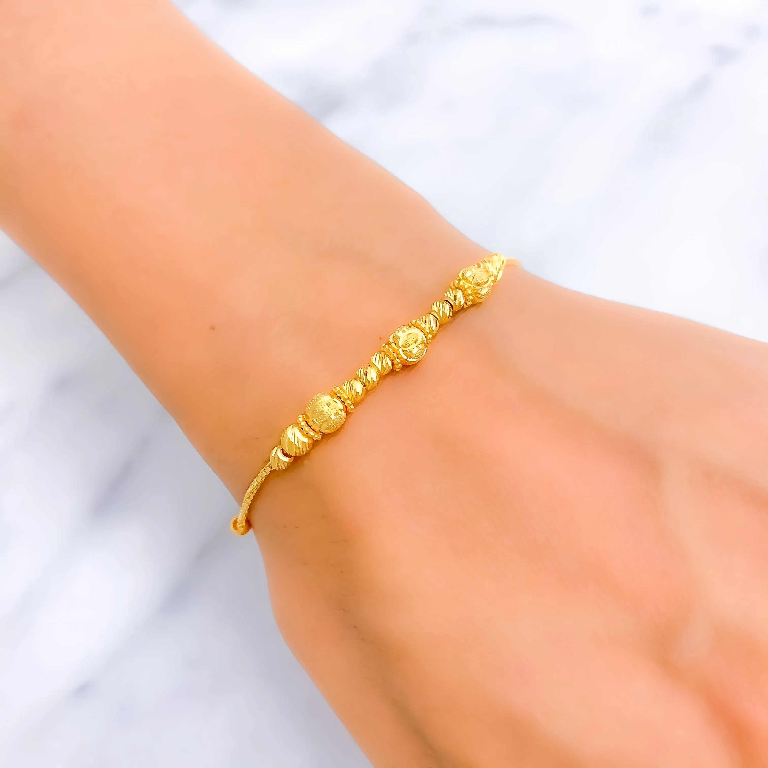 Captivating Striped Orb 22k Gold Bracelet