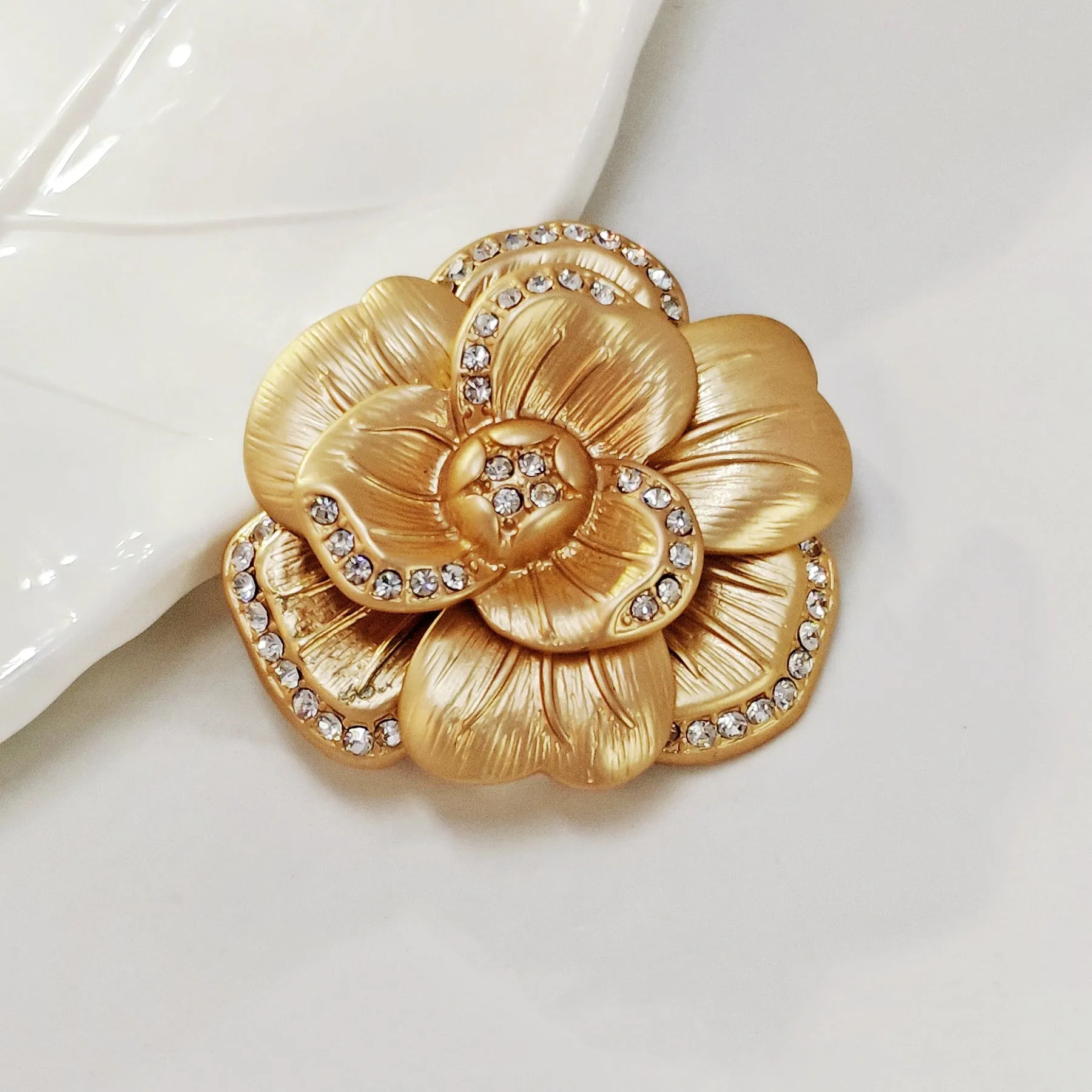 Elegancy Gold Metallic Bloom Camellia Flower Brooch Pin with Crystal Accent