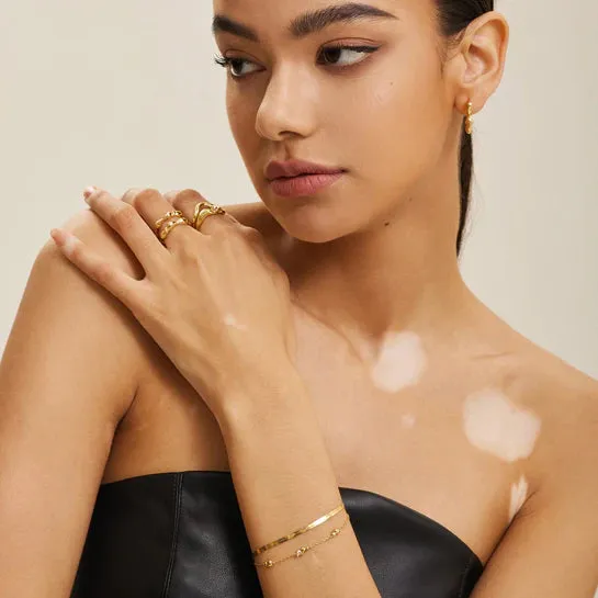 GOLD TWISTED WAVE BRACELET