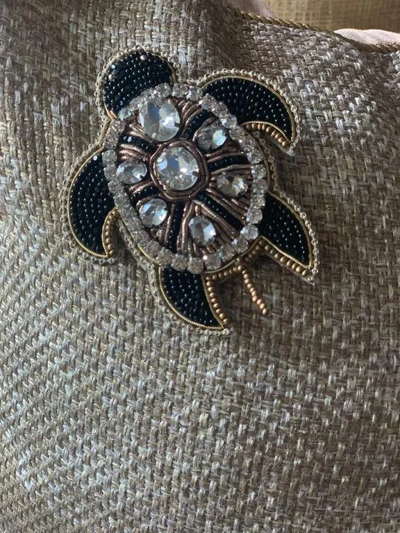 the telling tortoise brooch