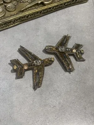 the travelling plane brooch