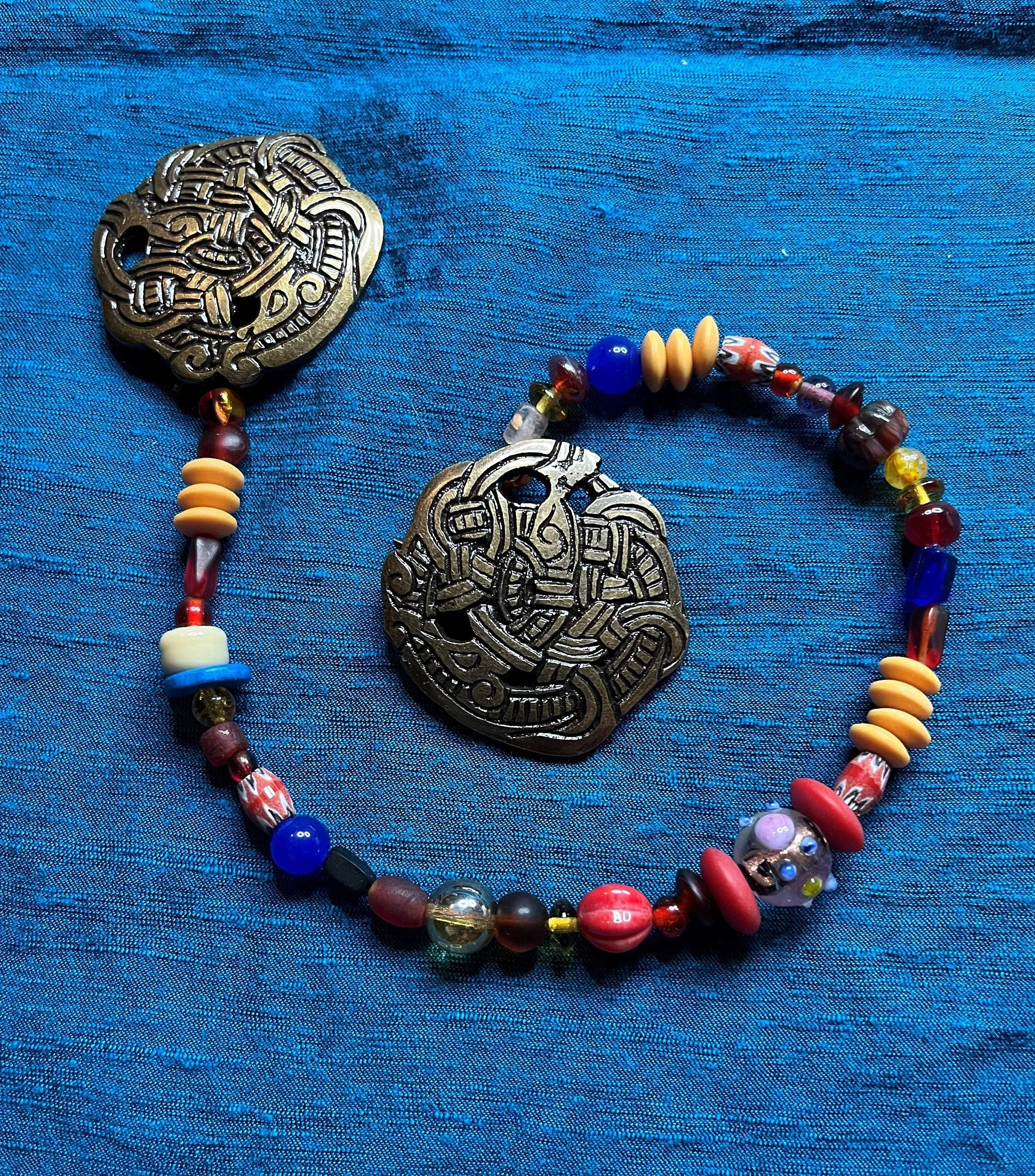 Viking Round Brooches and Glass Bead String