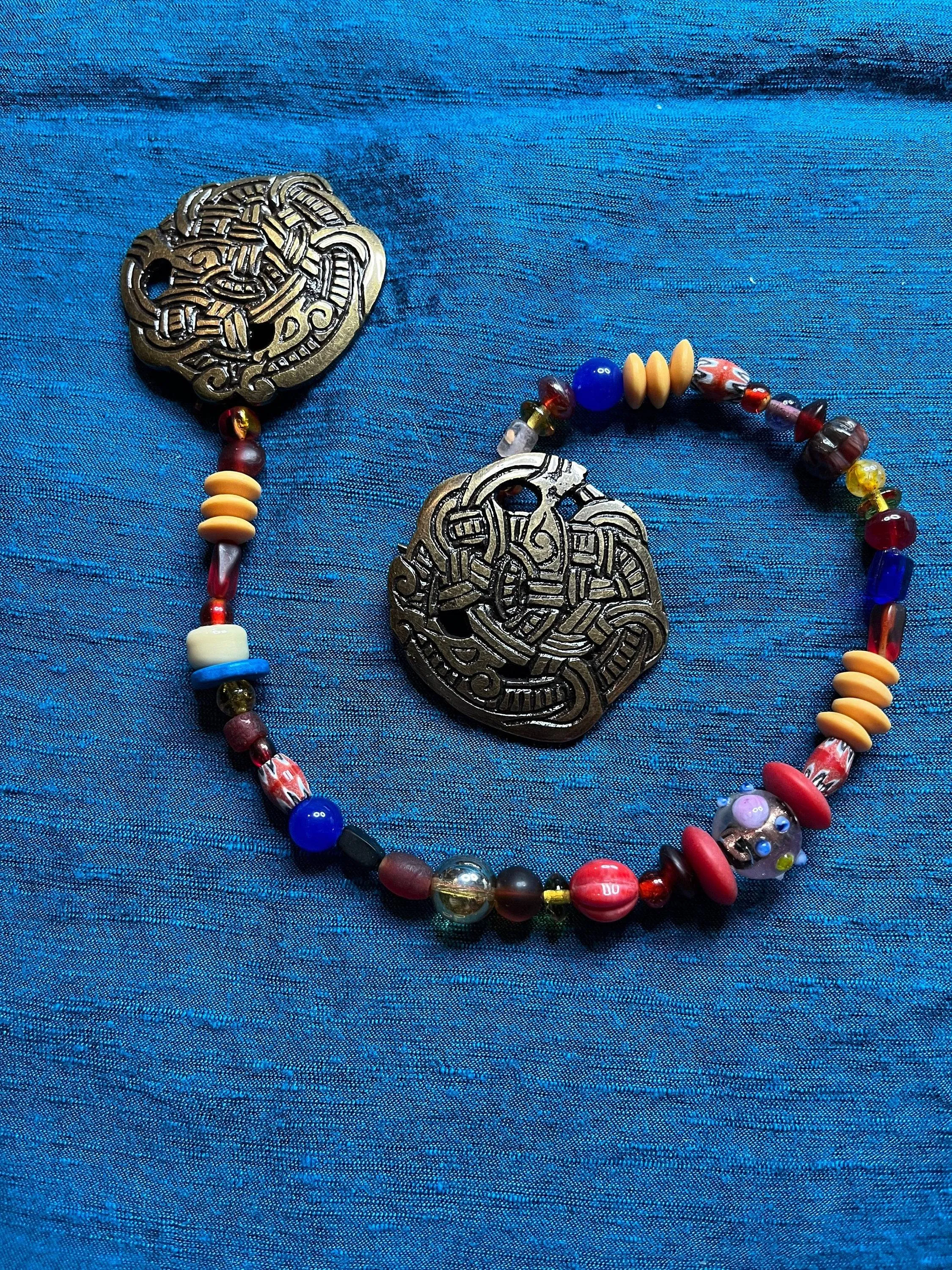 Viking Round Brooches and Glass Bead String